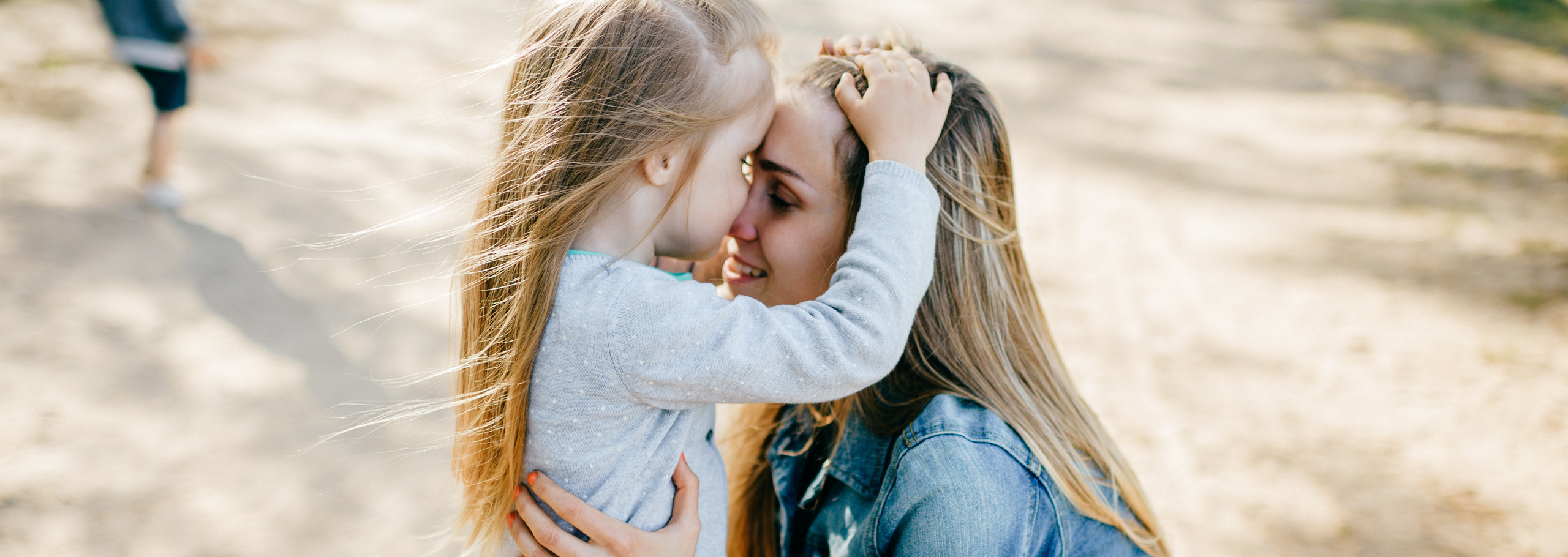 Mother hugging her daughter