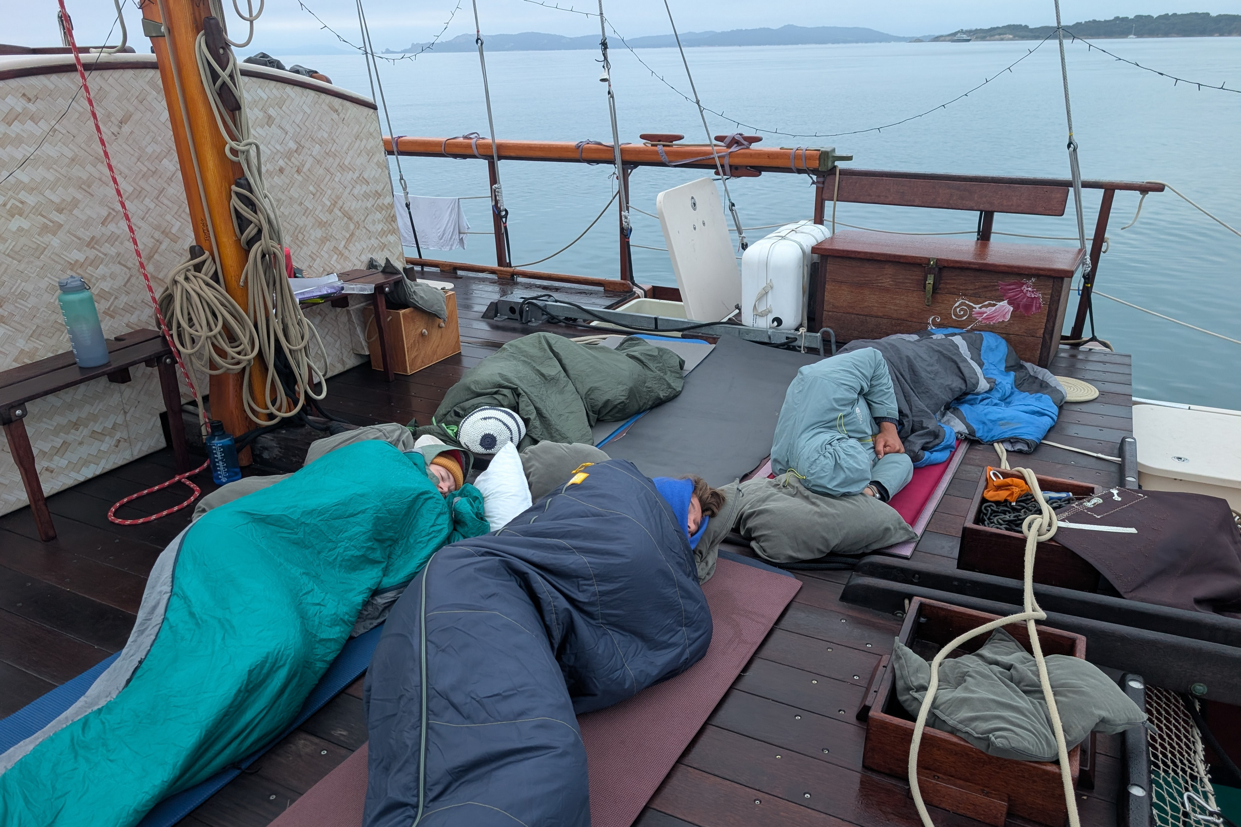 Students on deck n sleeping bags
