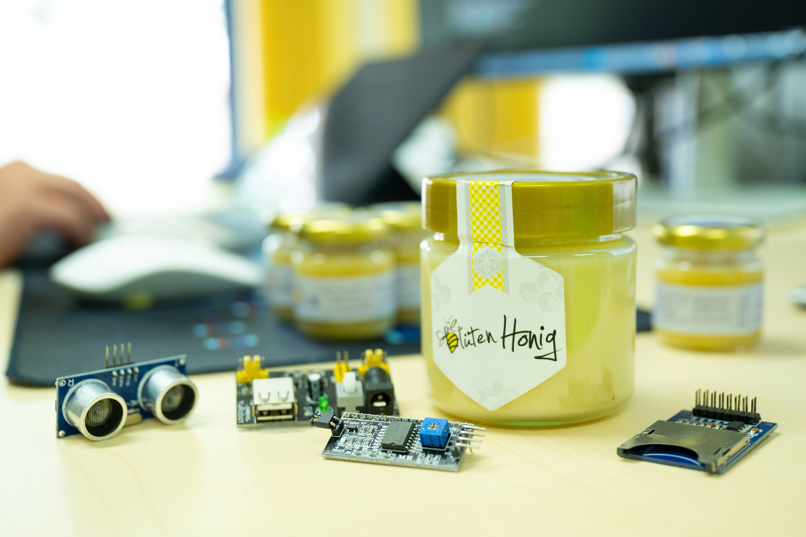 A jar of honey on Professor’s Zinn’s desk, surrounded by technical equipment