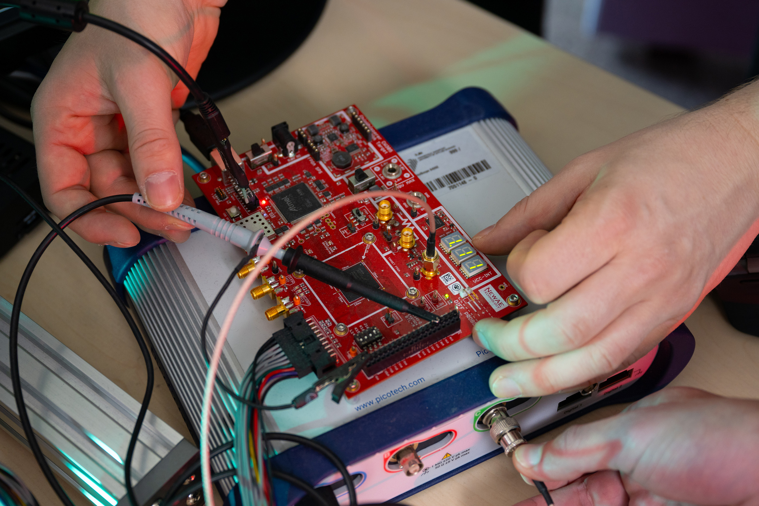 Side-channel analysis with the help of an oscilloscope and the ChipWhisperer platform.