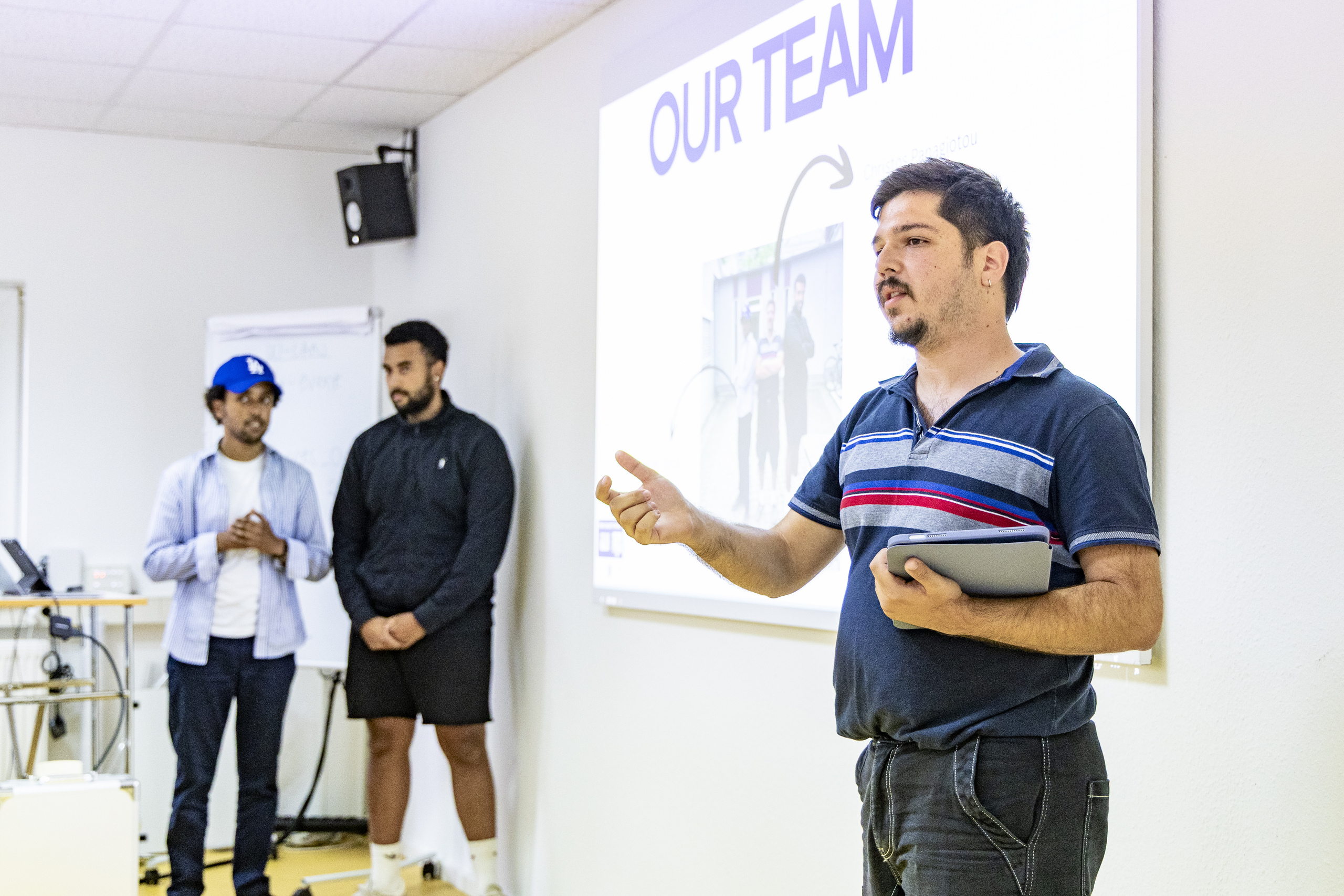 Three students introduce their team