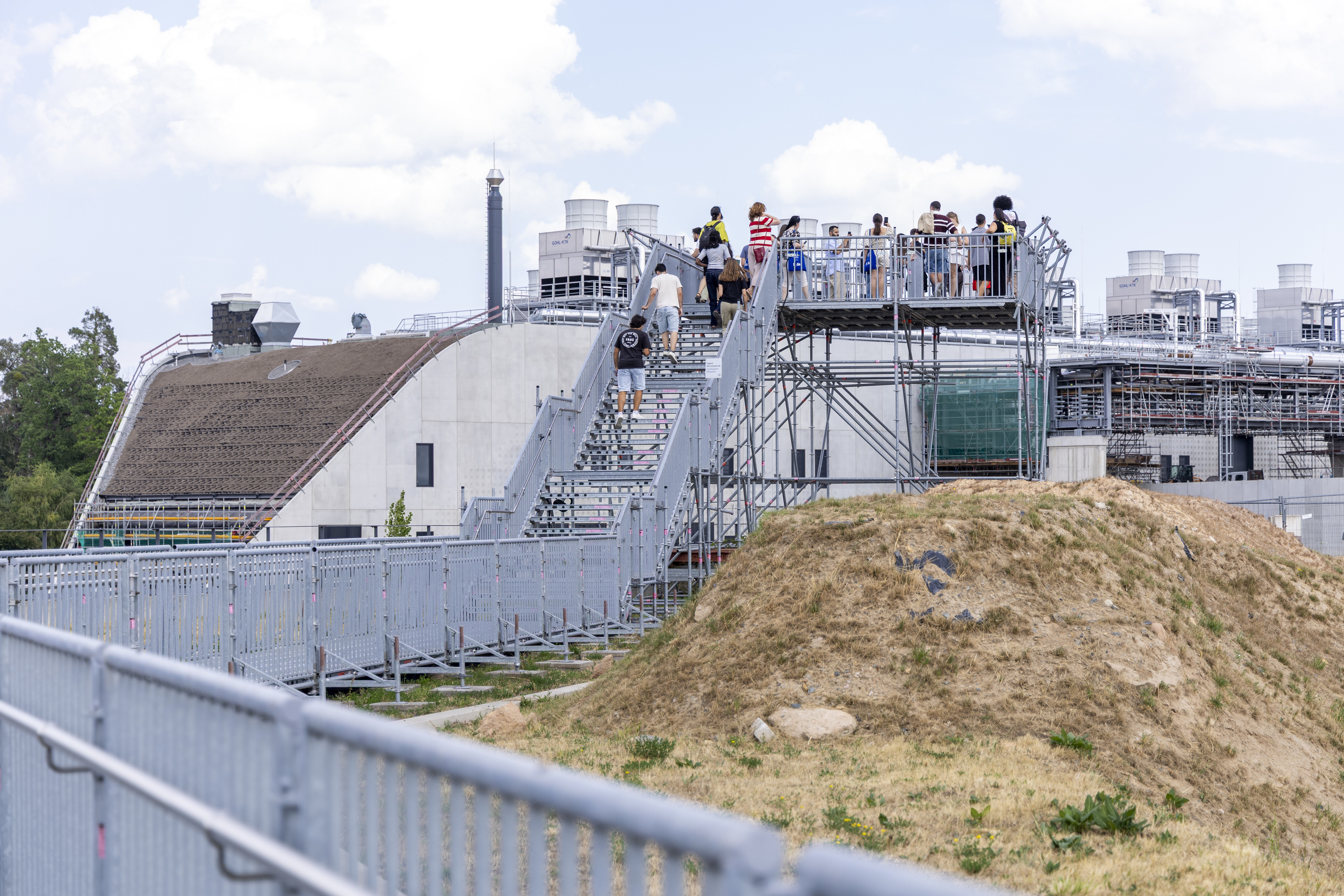 The whole group on a viewing platform on the GSI site