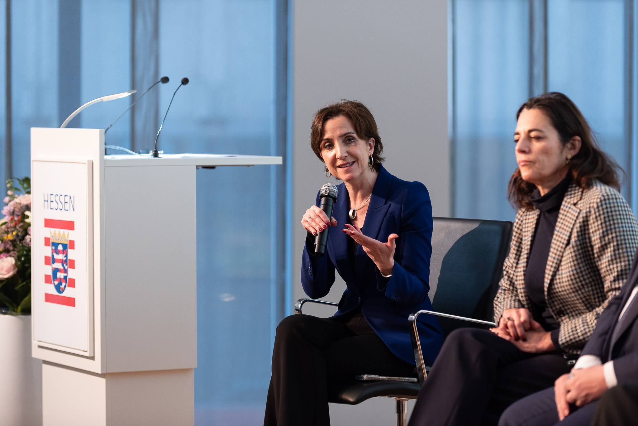 Two panellists on the podium